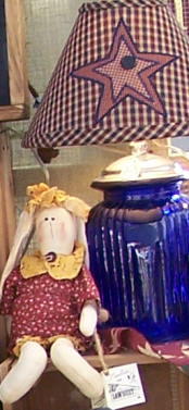 Craft show doll and lamp.